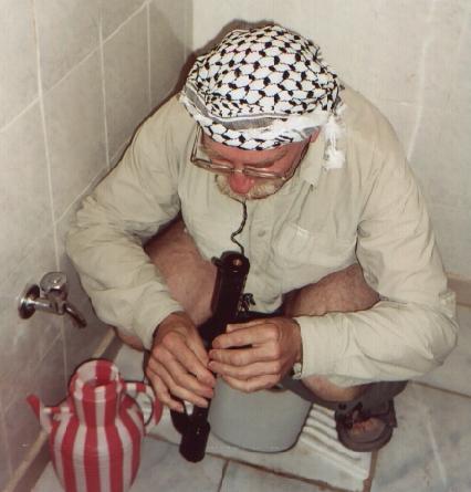 Playing the chanter while squatting in a Turkish loo