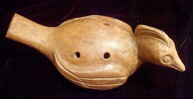 a Latin American ocarina shaped like a quetzal bird